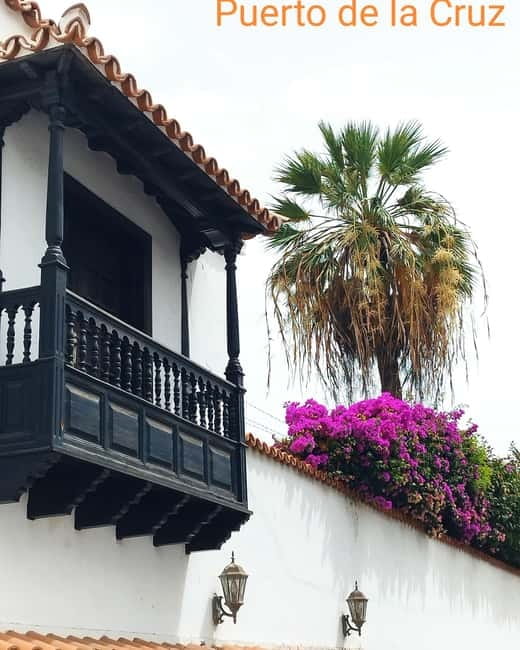1.5-hour walking tour of Puerto de la Cruz, Tenerife. - First Steps at the Pier: Meeting Monumento a la pescadera and the yellow scarf