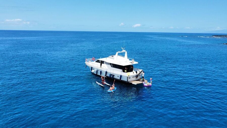 Costa Adeje: Private Yacht Trip with Watersports and Slides - The 3.5-hour rhythm: Los Cristianos, PalmMar cave stop, and Playa de las Vistas