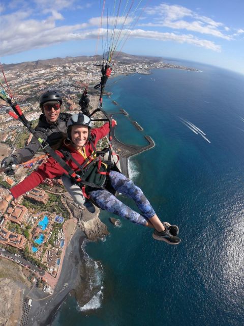 Costa Adeje: Tandem Paragliding Flight with Pickup - Safety setup: helmet, kneepads, and the emergency parachute