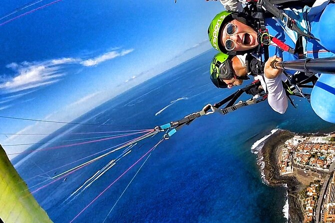GOLD paragliding flight including videos/photos, t-shirt and a bottle of Cava - La Caleta Beach Landing and the Practical Plan B