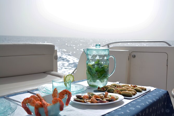 Private Boat Tour on Royal Ocean Yacht, Tenerife - Stop 2: Los Cristianos anchoring for snorkeling, swimming, and caves