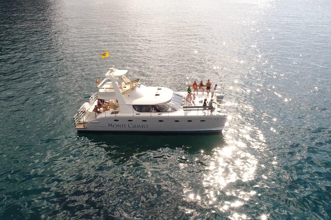 Private Catamaran Charter with Transfer, Buffet and Snorkeling - Where the day starts: Puerto Colón, Pantalan #6, and hotel pickup