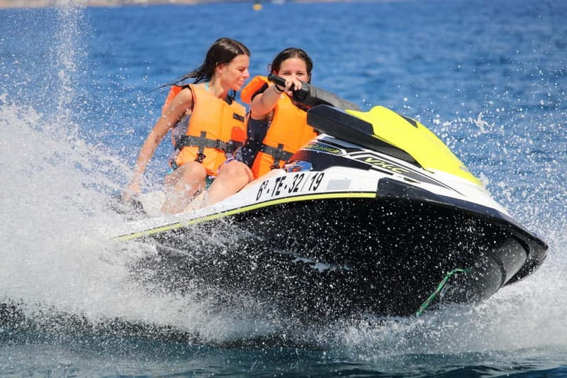 Puerto Colón: Tenerife Coast Jet Ski Tour with Photos - From Dock to Jetski Island: How the Tour Starts