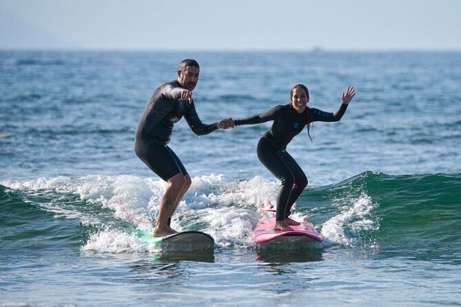 small group surf lesson in Playa de las Américas,Tenerife - Kontraola Meeting Point to Beachfront Warm-Up