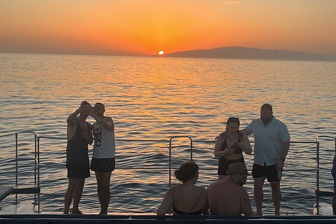 Tenerife Sunset Catamaran tour with transfer - Food and Drinks included. - The Crew Energy: Friendly Service, Drink Refills, and Whale Spotting Talk